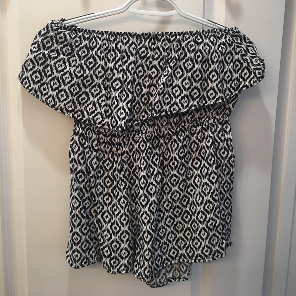 This is a black and white romper.