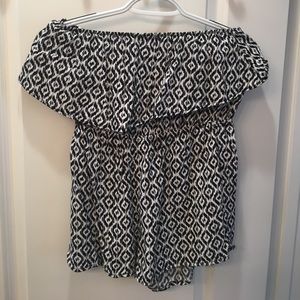 This is a black and white romper.