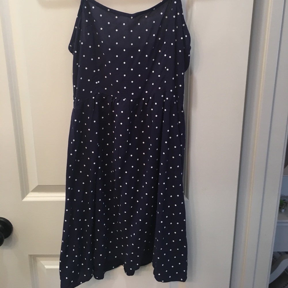 This is a navy and white polka dot dress.