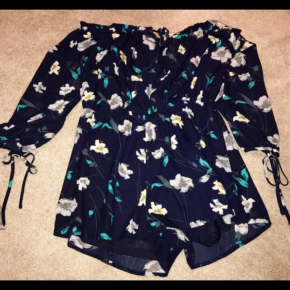 Romper worn once and is in great condition!