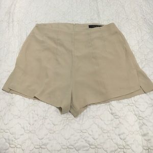 "OVI" tan shorts. Excellent condition (M)