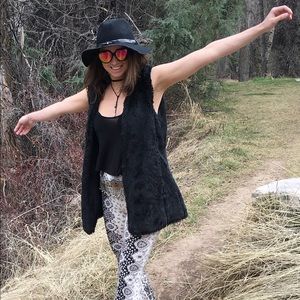 Long black faux fur vest