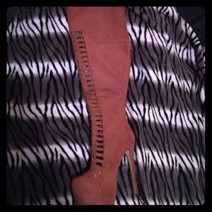 Some brown thigh boots