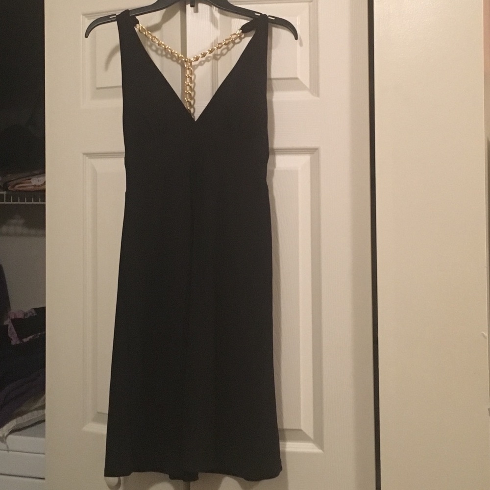Black halter dress with gold chain link