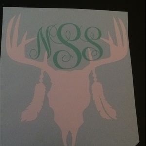 Deer skull monogram with feather.