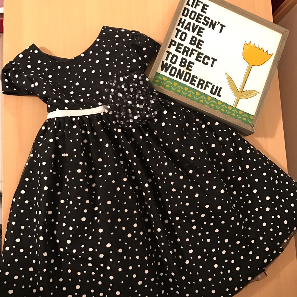 Toddler black tulle dress with white polka dots.