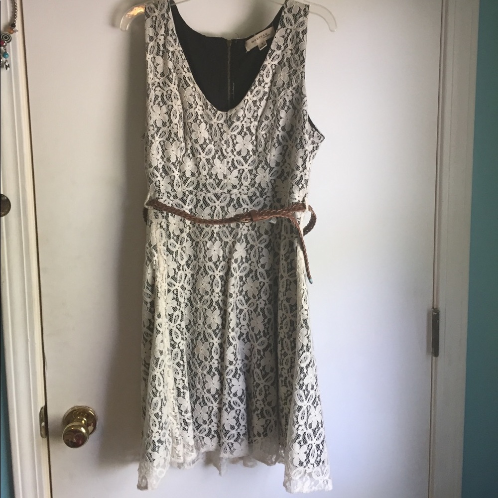 Off white lace covered black midi dress.