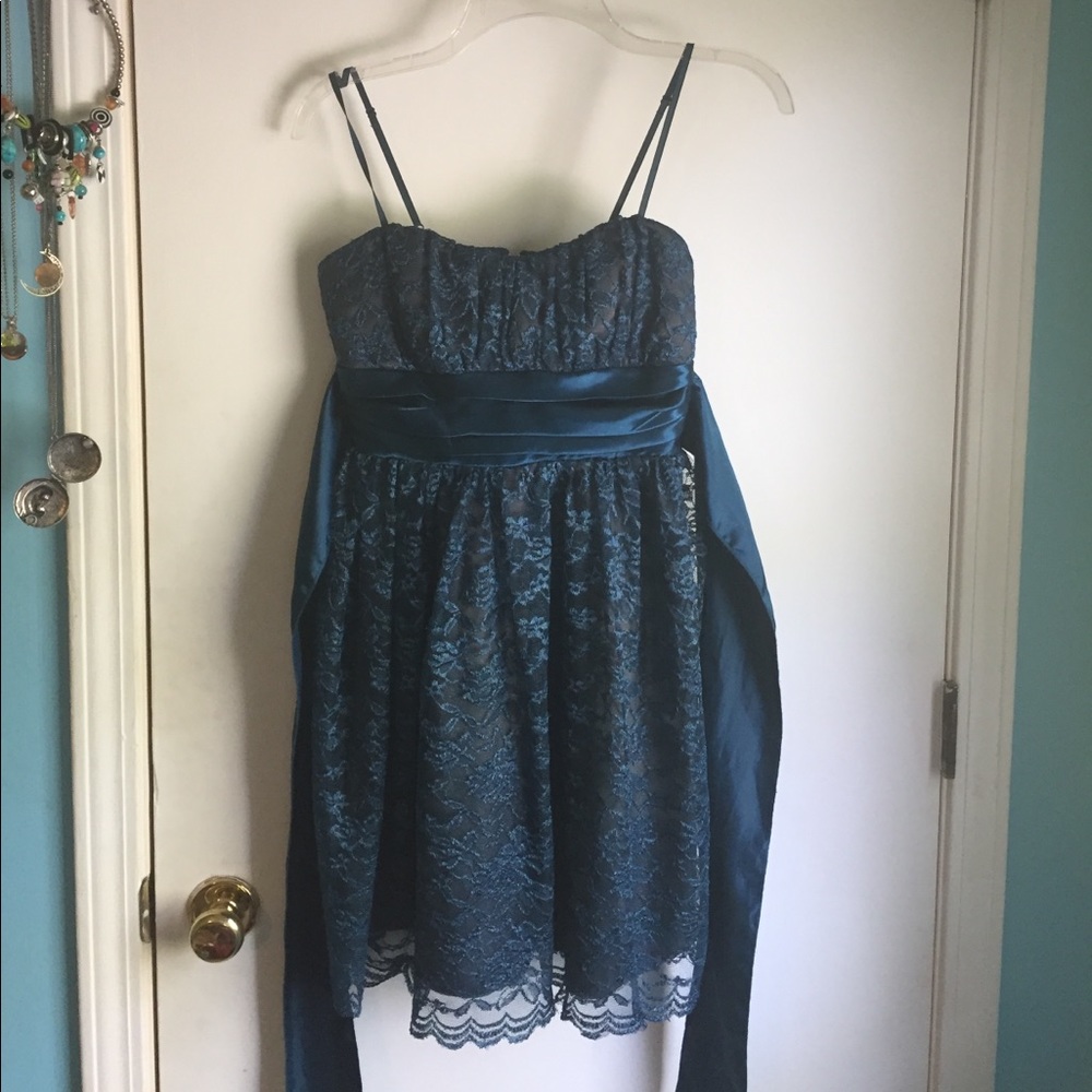 Dark turquoise padded mini dress with lace over