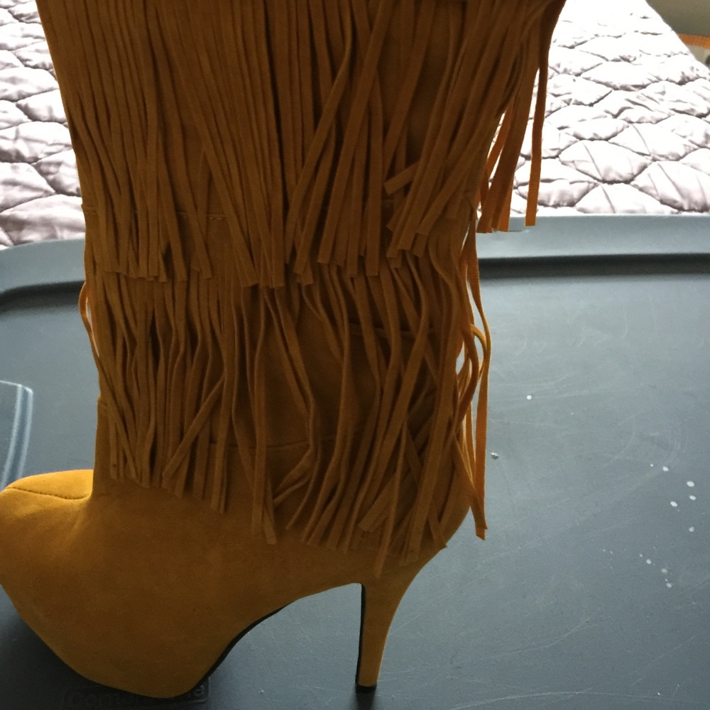 8.5 mustard color fringe boots.