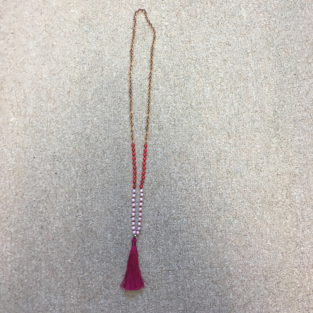 Long beaded necklace with tassel at the end