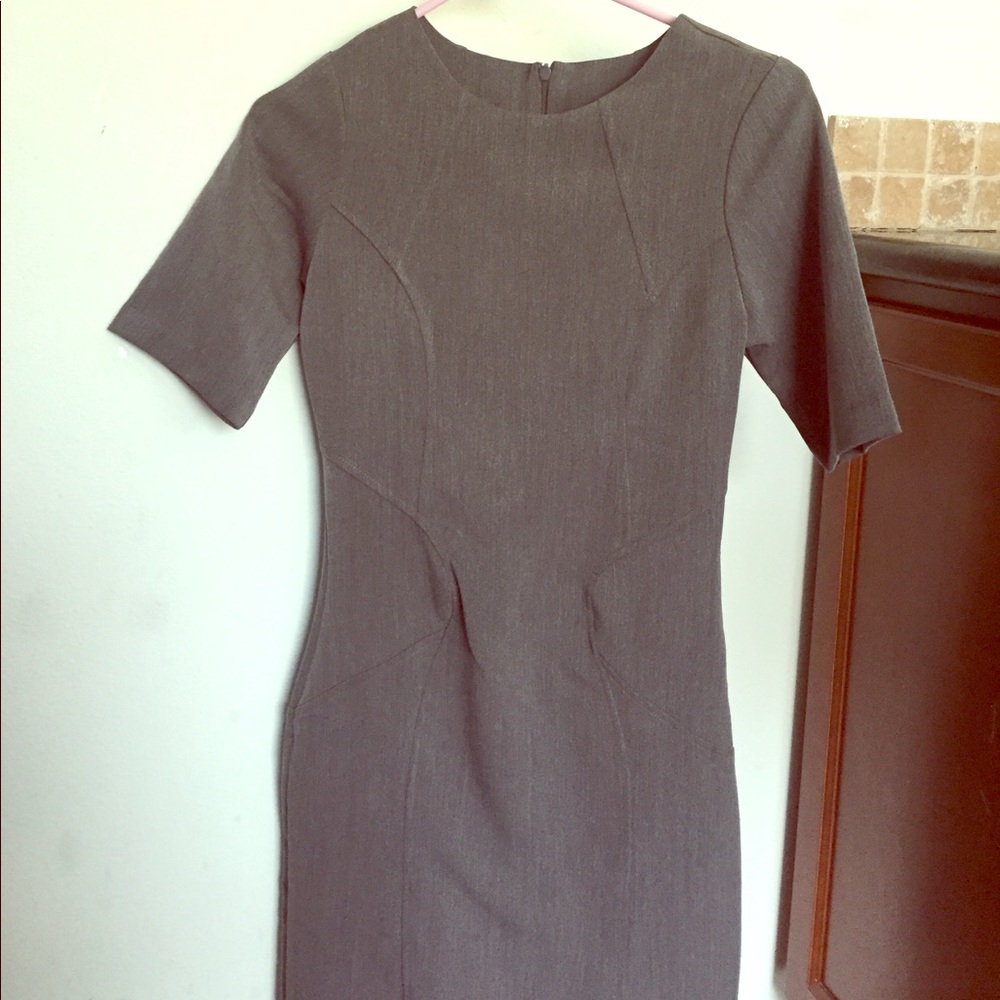 Gray figure flattering sheath dress.