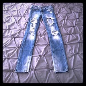 Distressed denim jeans