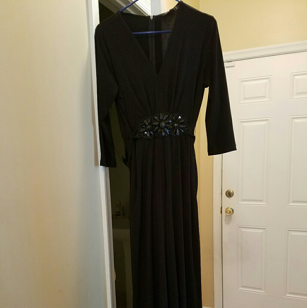 Never worn black jumper, deep neck, sequin middle.