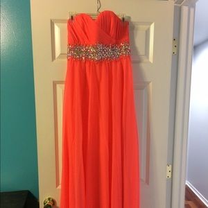 Bright coral strapless prom dress