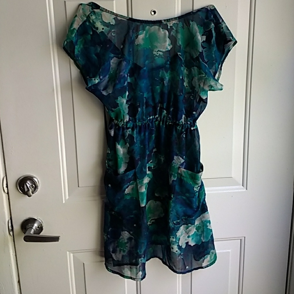 Long, sheer blouse with pockets