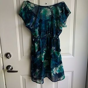 Long, sheer blouse with pockets