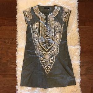 Gray embroidered tunic.