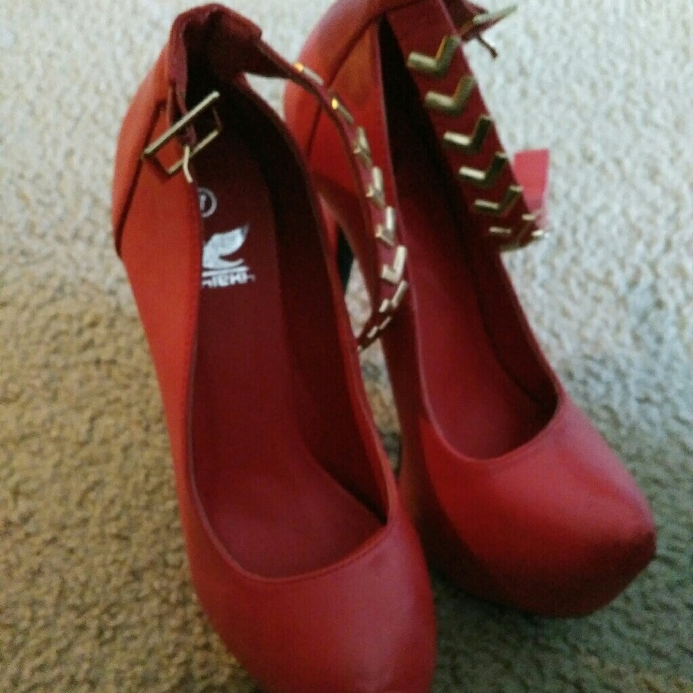 Red leather pumps