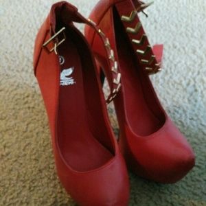 Red leather pumps