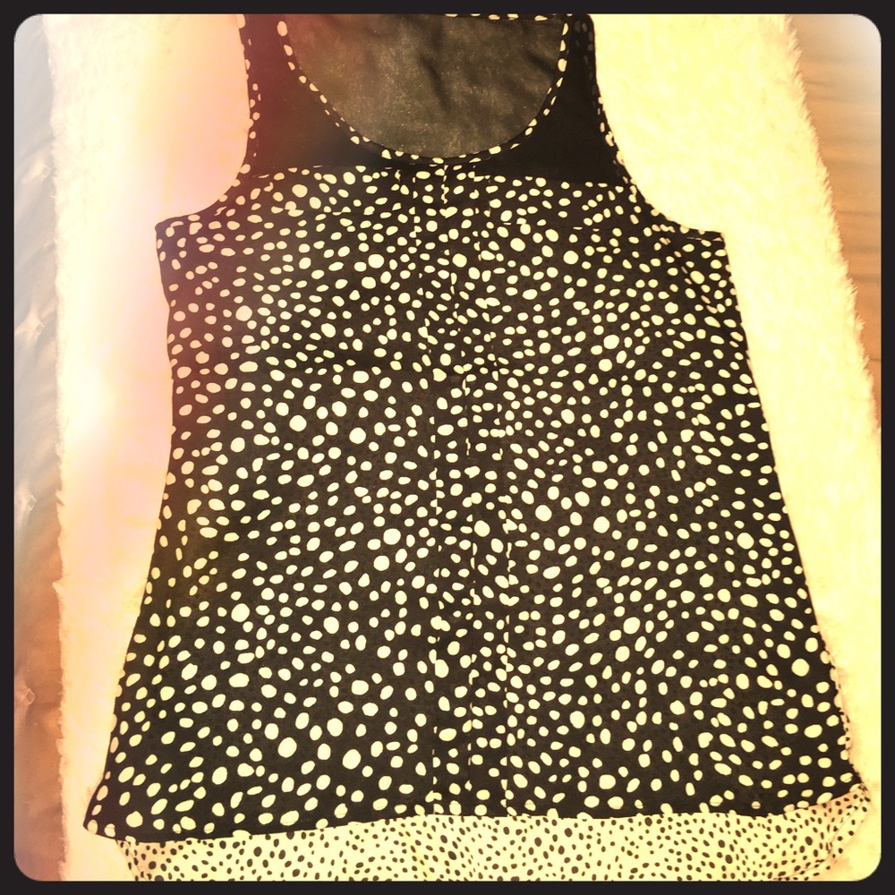 Black and white polka dot sleeveless blouse