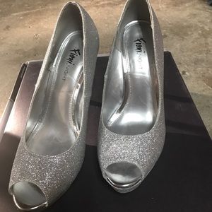 Silver peep toe pumps.