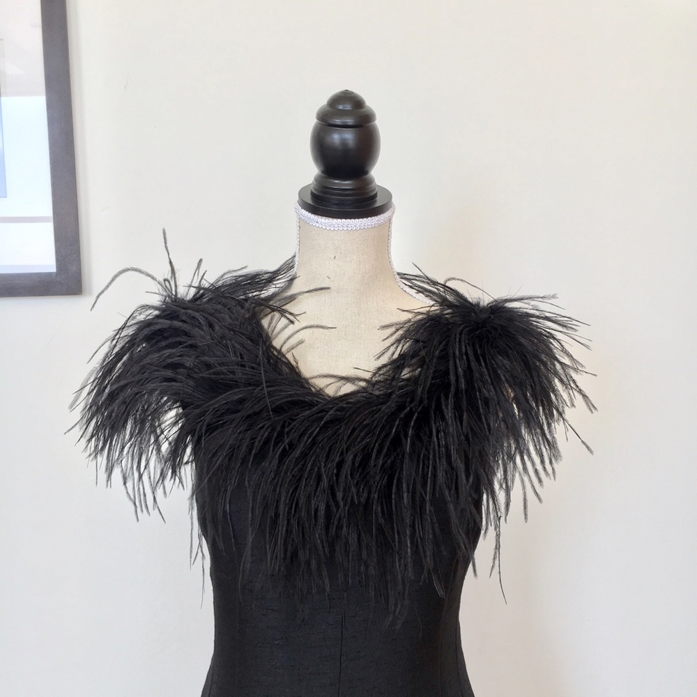 Elegant black dress with feathers