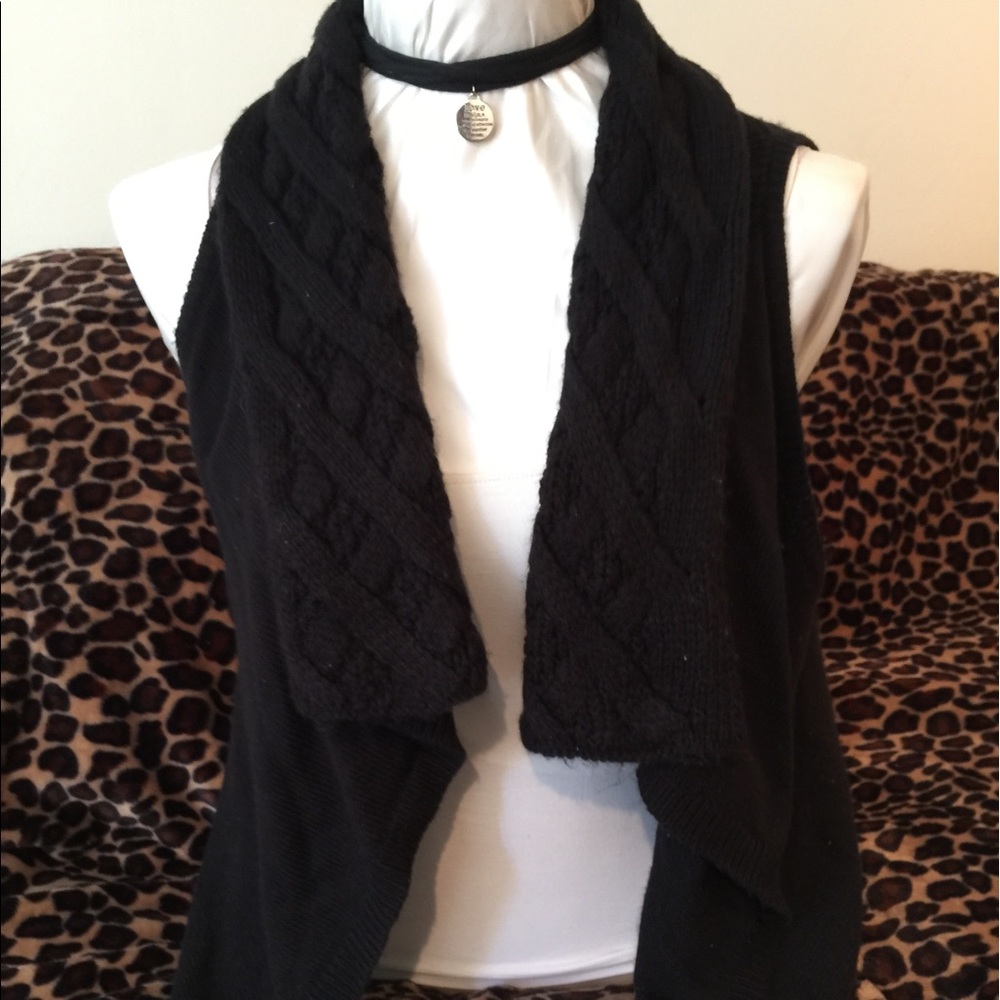 Sweater vest.  Black shawl.  Shrug. Sleeveless.