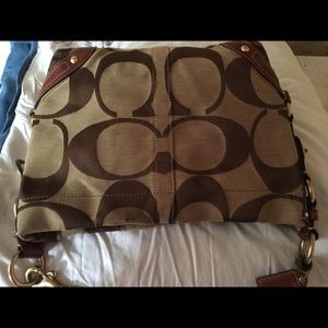 Coach zip top handbag for everyday use.