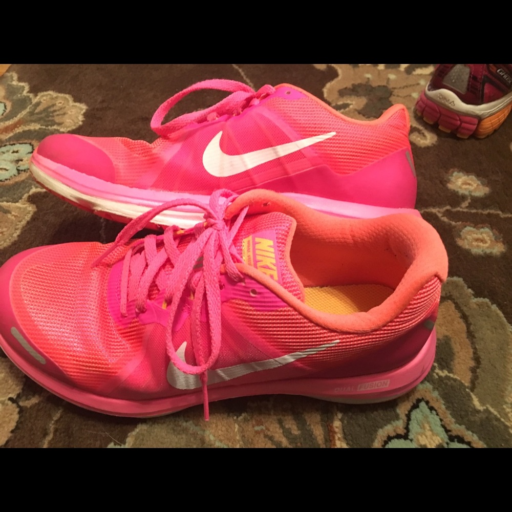 Pink and orange nikes.
