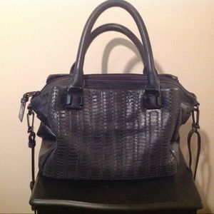 Elliot Lucca  hand and cross body black purse.