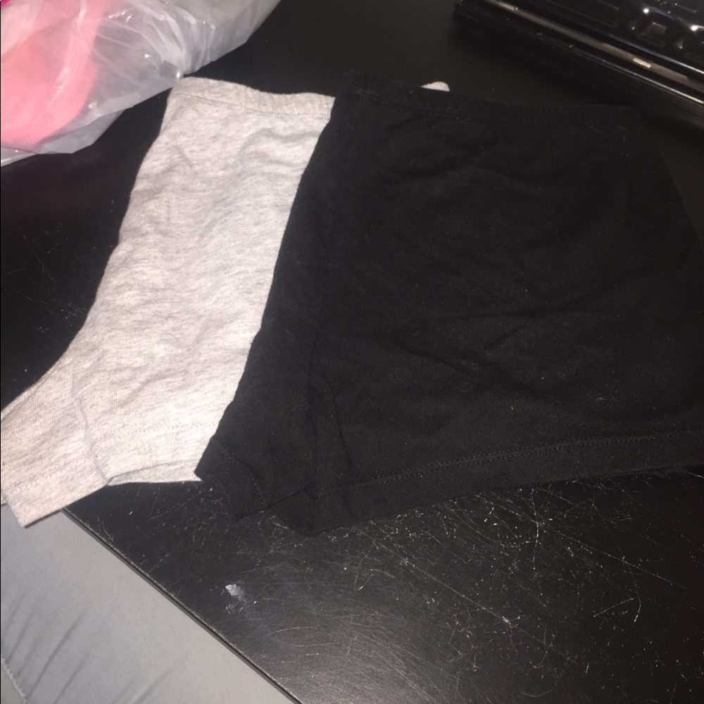 2 booty shorts. One is black the other is gray.