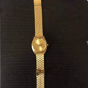 Gold Nixon watch