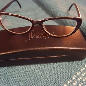 Black and white polka dot cat eye glasses.