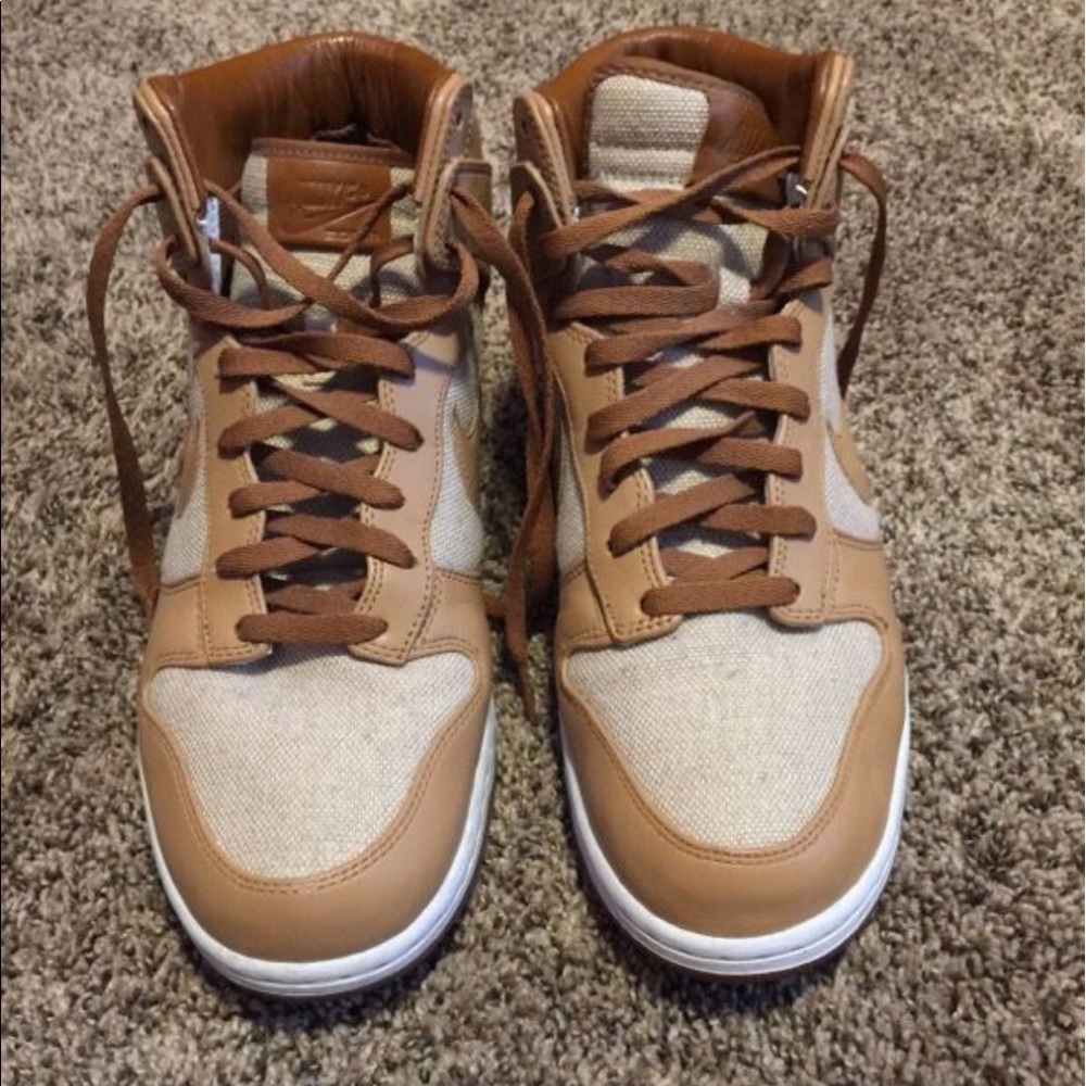 Tan high top Nike sneakers