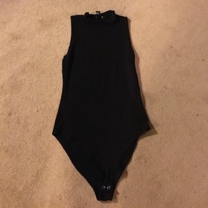 Black high collar body suit. NWOT never worn