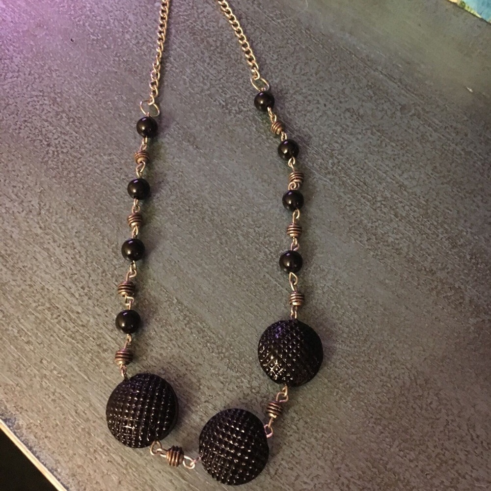 Handcrafted black beaded necklace.