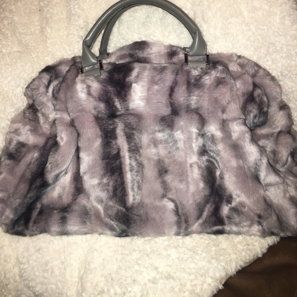 A faux fur carry on bag