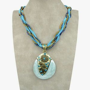 Blue teardrop pendant with braided necklace