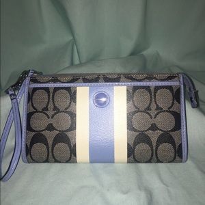 Black and blue Coach wristlet