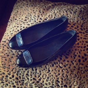 Chanel navy and black paten leather CC flats.