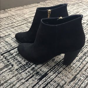 Black ankle booties with gold zipper details!