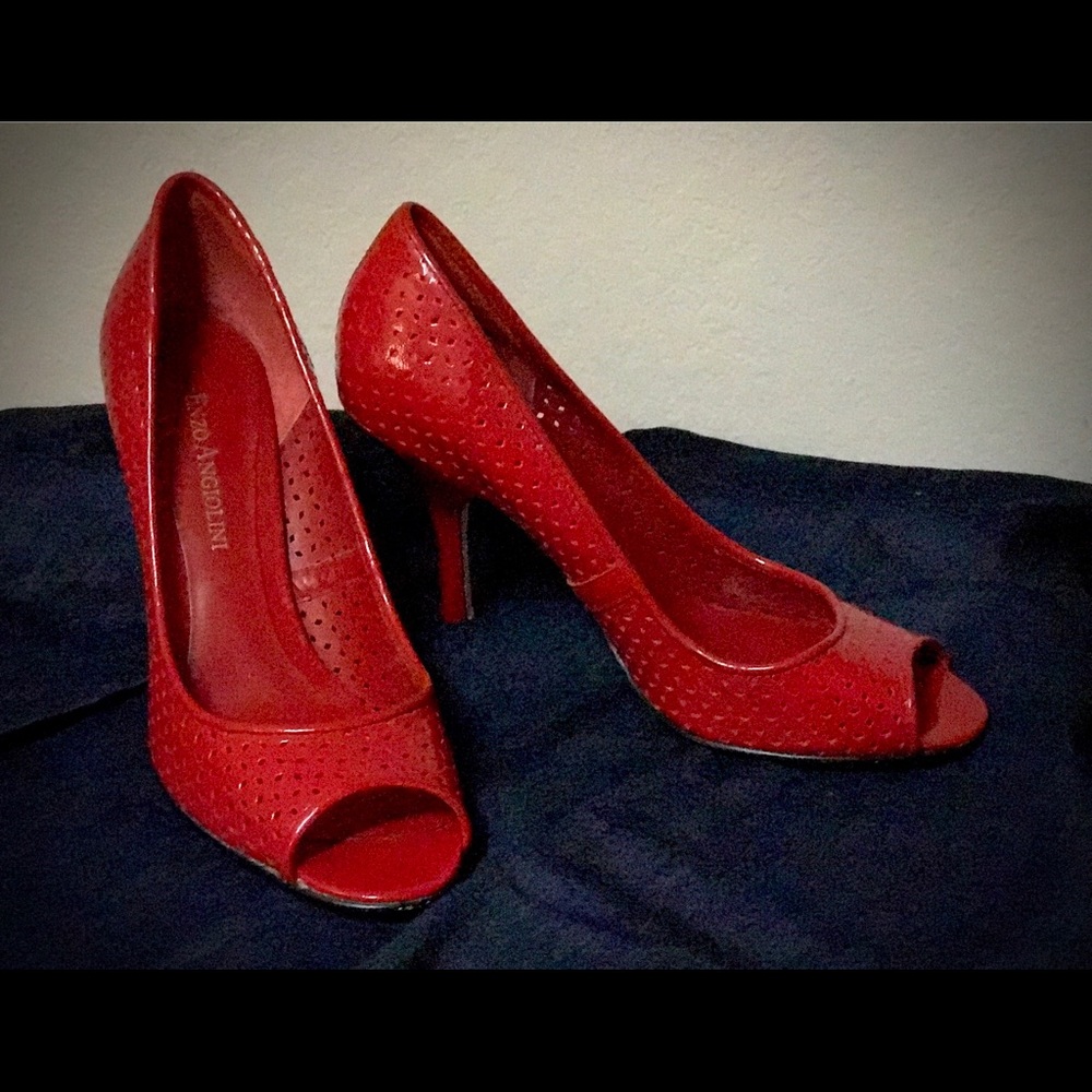 Red patent peep toe shoes.