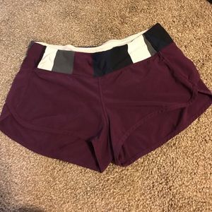 Size 6 burgundy Lululemon 2- way speed shorts