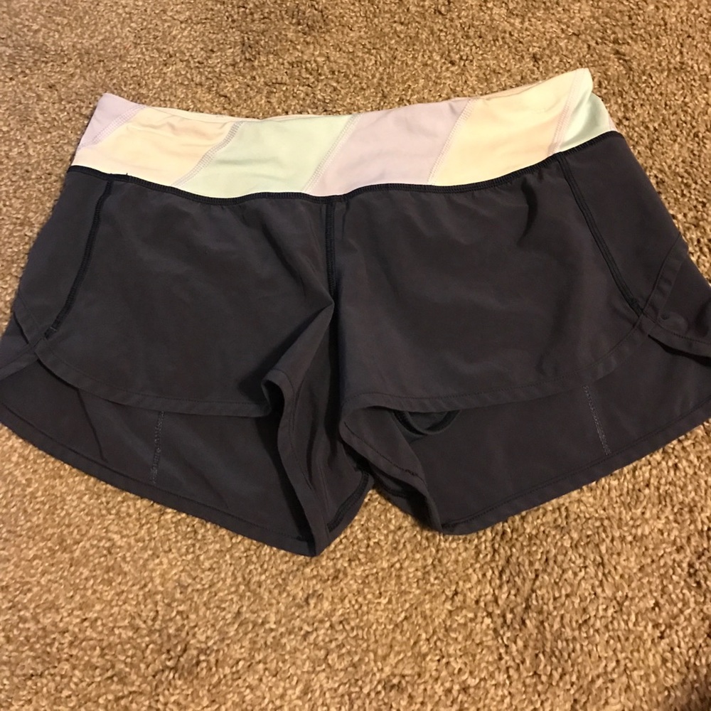 Size 6 navy Lululemon 2-way speed shorts!