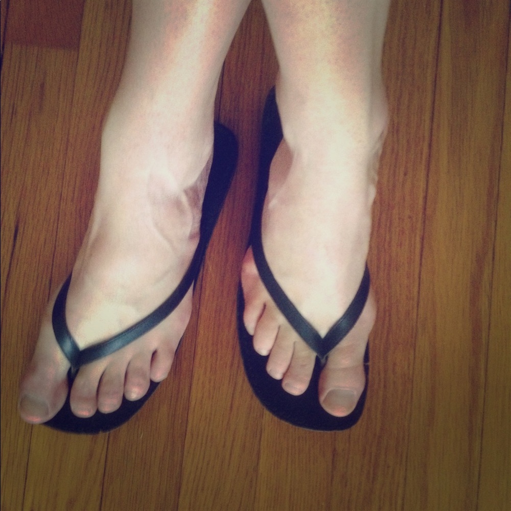 Well worn flip flops, women's size 9.