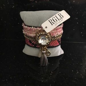 Lauren janelle bracelet pinks,black /tassels charm