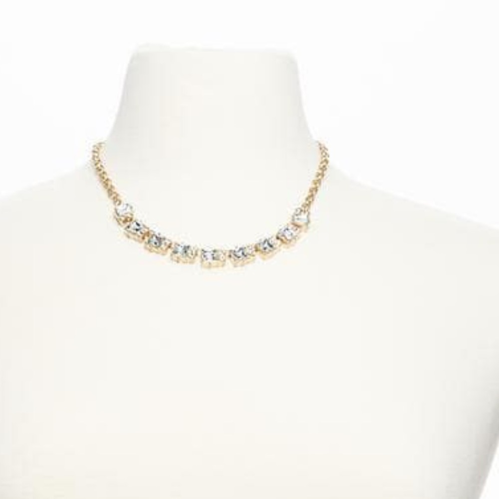 Gold necklace with crystal squares.