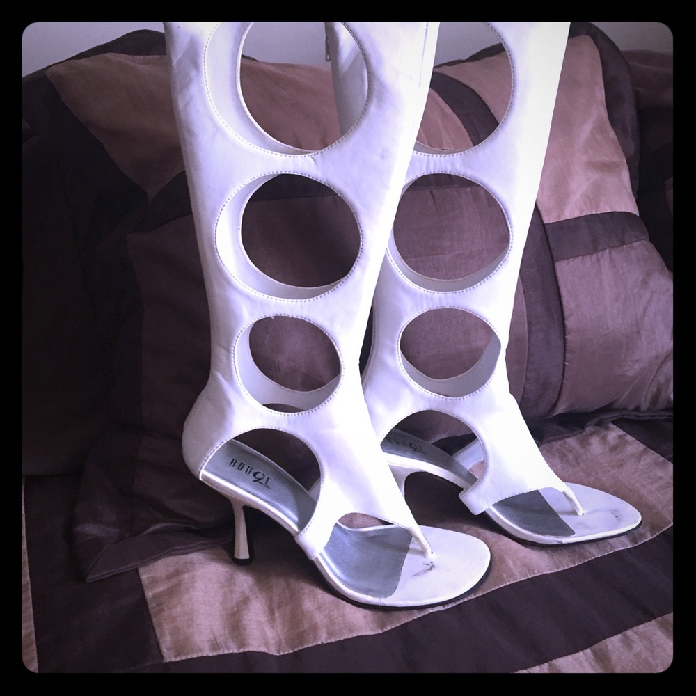 white multi-circle cutout boots.