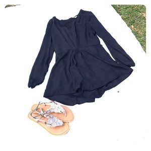 Black romper and sandals
