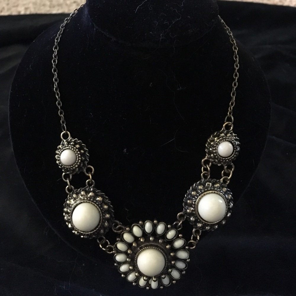 Bronze necklace with cream colored accents